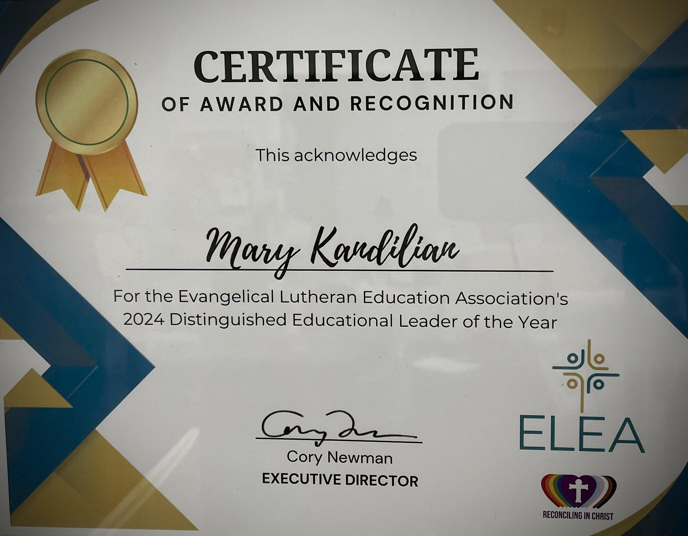 Image of Mary Kandilia's certificate of award and recognition as Distinguished Eduacationasl Leader of the year.